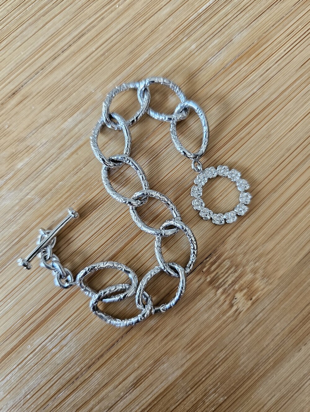 Silver Textured Link Toggle Bracelet with Floral Detail